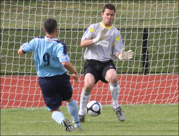 Alex Sykes nutmegs Corby keeper Mark Osborn to score City's fourth