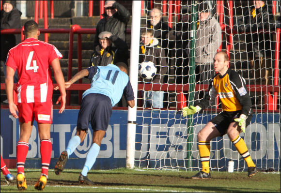 Bagasan Graham just fails to connect with the ball as it flies across the Altrincham goal