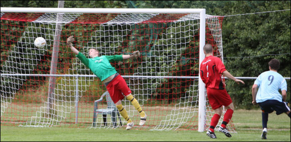 Trialist Mitchell Bryant brings the best out of the Pegasus Juniors goalkeeper