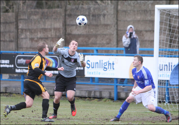 Celtic keeper Alex Cairns and Darren Edwards both reach for a loose ball in the six yard box