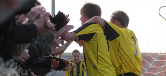 Will Morford celebrates with the fans after heading the winner