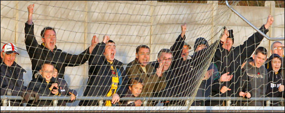 The City fans cheer as Neil Mustoe's penalty finds a way over the line