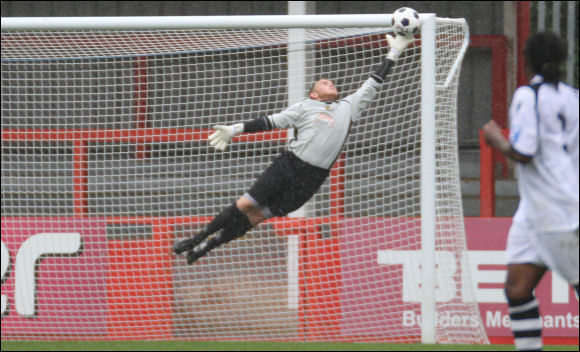 Conor Thompson with a flying save against Solihull Moors