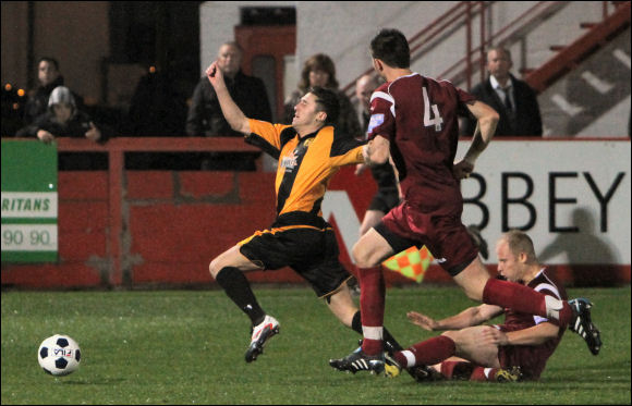 City sub Steve Davies is cynically fouled by Corby's Paul Mayo