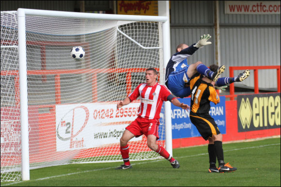 Steve Davies is clattered by Alty keeper Stuart Coburn after scoring the equaliser