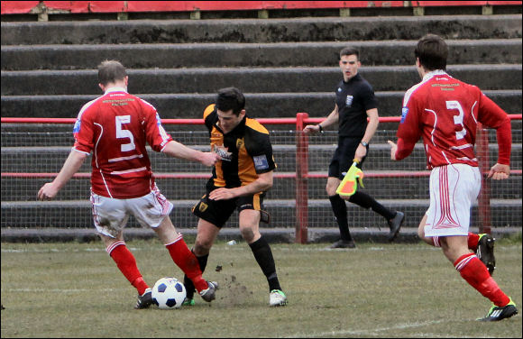 Steve Davies is fouled by Workington's Dan Holdsworth for a penalty