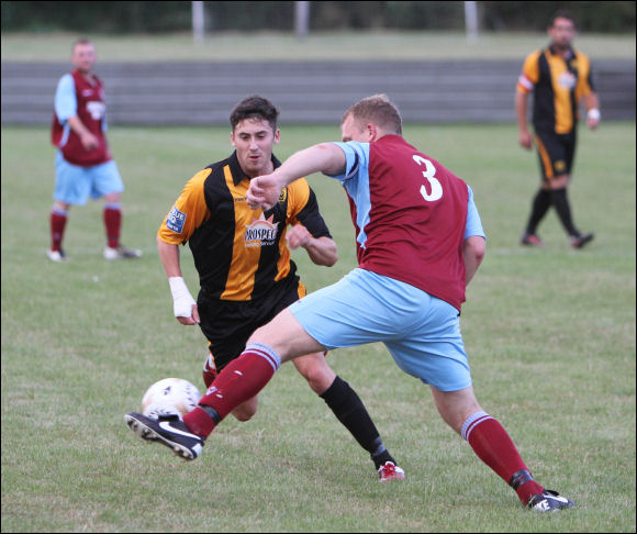 Steve Davies tries to pass former Southampton striker Shayne Bradley at the Tuffley friendly