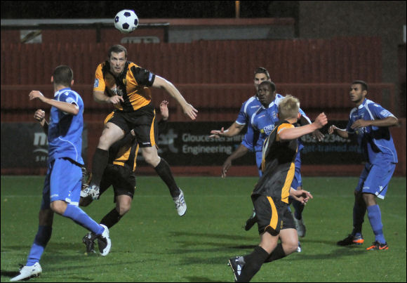 Chris Holland stoops to head home his first and City's second of the game