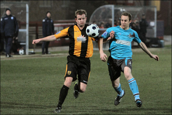 Darren Edwards holds off an Altrincham opponent