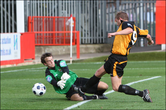 Darren Edwards beats goalkeeper Aaran Taylor to the ball to score City's second goal