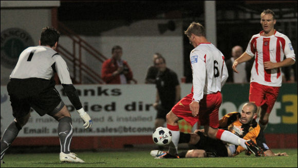 Lewis Hogg attacks for City against Brackley