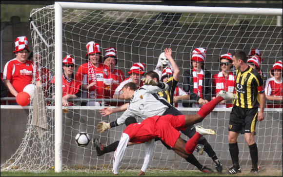 Ilkeston's Amari Morgan-Smith dives in to score the only goal of the game