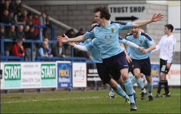 Jack Harris wheels away in celebration after scoring the only goal at the New Bucks Head