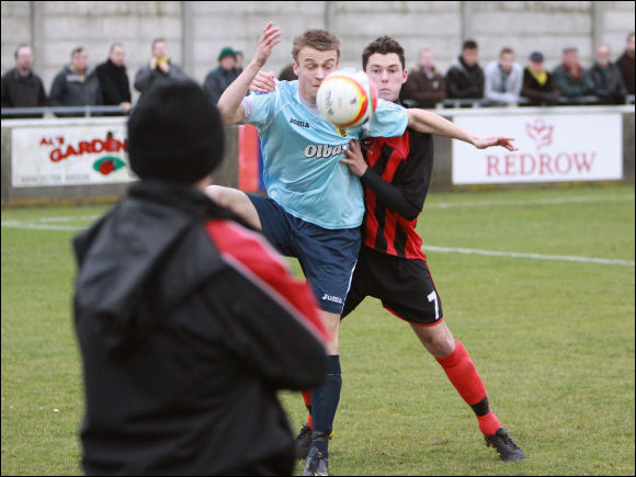 City debutant Jake Harris controls the ball under the gaze of Kev Willetts