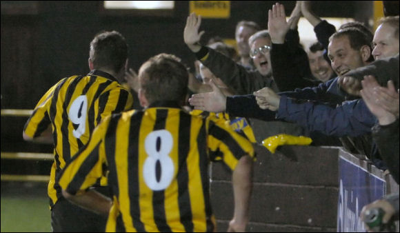 Jody Bevan celebrates with the fans after his goal against Chippenham