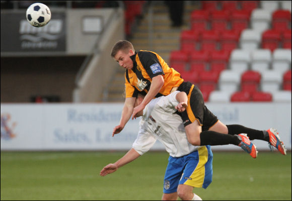 Jordan Goddard flies over a Maidenhead opponent