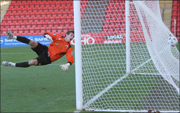 Goalkeeper David Knight arches back in vain as Darren Mullings' free kick finds the back of the net