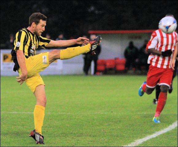 Chris Knowles clears his lines at Brackley