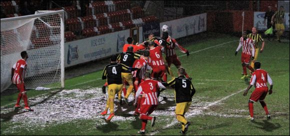 Chris Knowles rises highest from a pack of players to equalise for City today