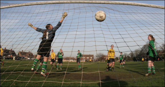 Laura Green powers home a header from a corner for City's fifth goal of the game