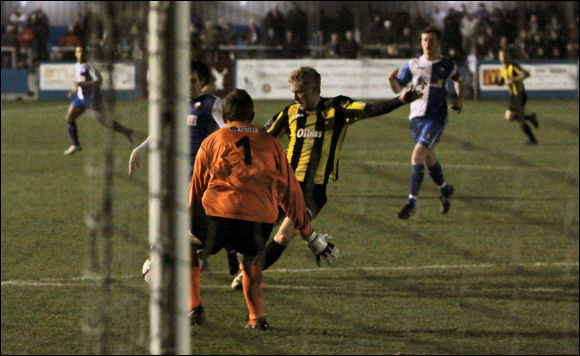 Sam Malsom is closed down by Nuneaton keeper Danny Alcock for City's best chance