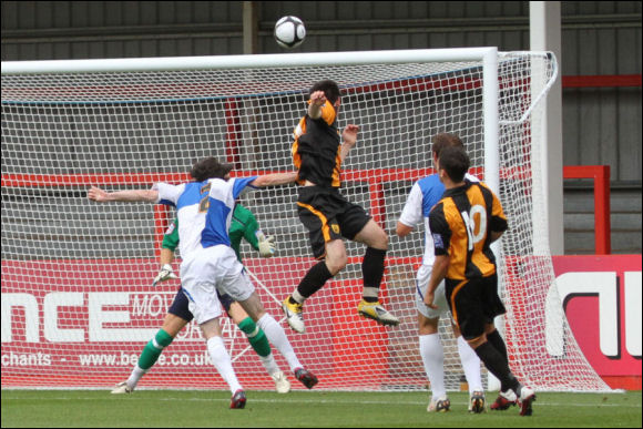 Adam Mann powers home a header to equalise against Bristol Rovers