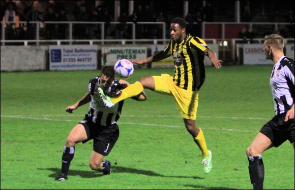 A Bath defender dives in bravely at the feet of Nathan Modest