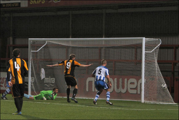 Darren Edwards watches as Will Morford's header hits the back of the net