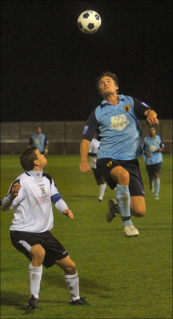 City striker Will Morford gets airborne at Solihull