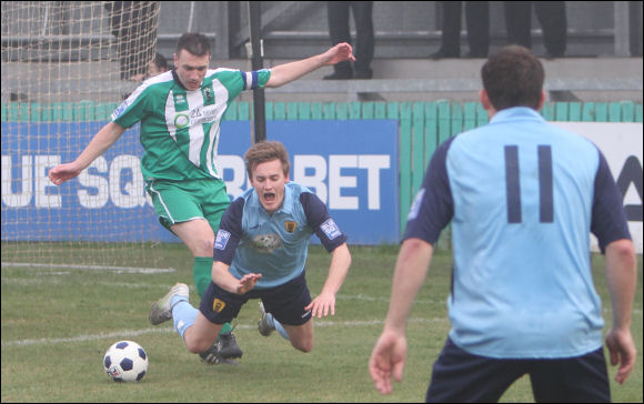 New boy Dave Bird watches on as Will Morford is fouled for City's penalty