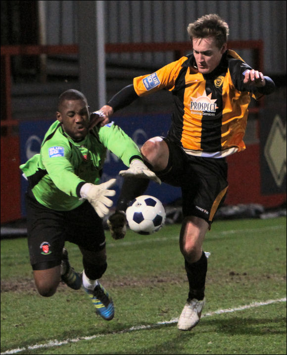 Danzelle St-Louis Hamilton appears to get the ball ahead of Will Morford as a penalty is given