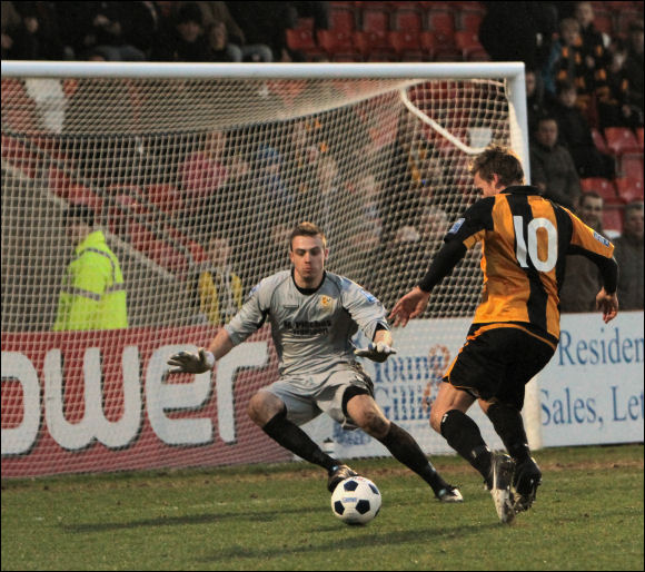 Will Morford waits to lift the ball over Worcester keeper Matt Sargeant to make it 3-0