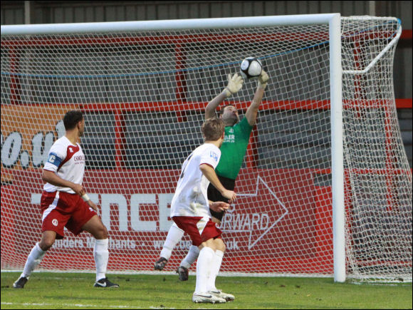 Chelmsford's Ashley Harrison paws away Darren Mullings' header but the linesman says it's a goal!