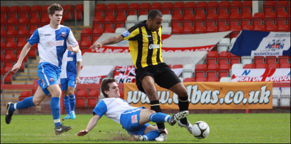 Darren Mullings is the victim of a lunge by Nuneaton's Simon Forsdick