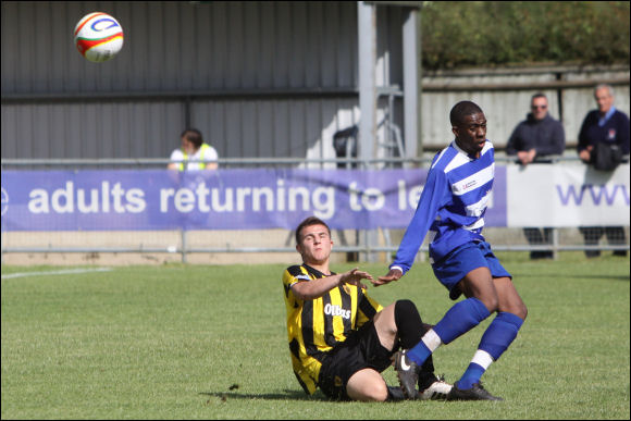 City trialist Billy George clears under pressure from an opponent at Oxford City today