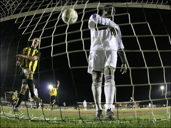 Marcus Palmer slams the ball into the empty net after Jamie Reid had scored City's fifth goal