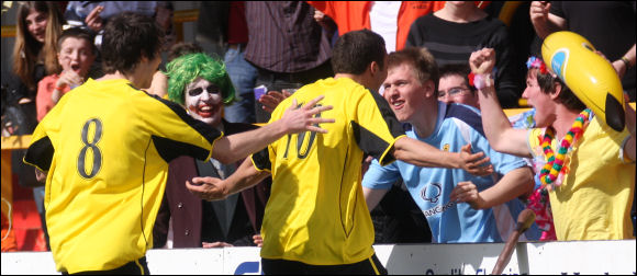 Jack Pitcher celebrates his goal with the City fans at Hemel