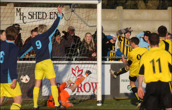 Jack Pitcher slams the ball home for City's equaliser against Tiverton