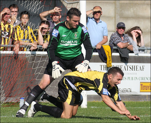 Jack Pitcher is sent to the ground by Workington keeper Tony Caig