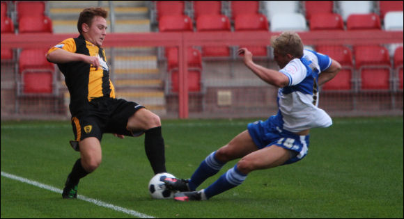 Sam Rawlings is the victim of a two-footed lunge by Rovers player Mitch Harding