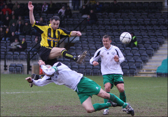 Matt Rose powers in to shoot against Bashley