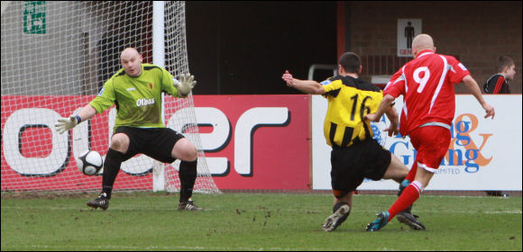 Kev Sawyer makes himself big to stop Eastwood's Lindon Meikle adding a third