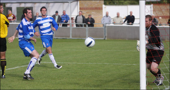 Mike Symons watches as his header bounces into the far corner against Oxford City