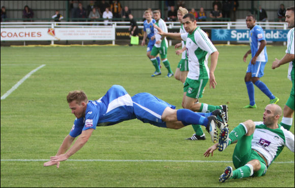 Winger Matt Groves is sent flying by his North Ferriby opponent