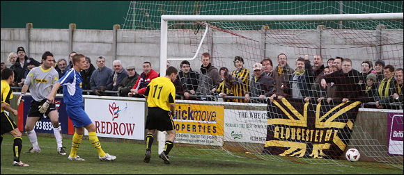 Alex Sykes' shot finds the far corner against Corby