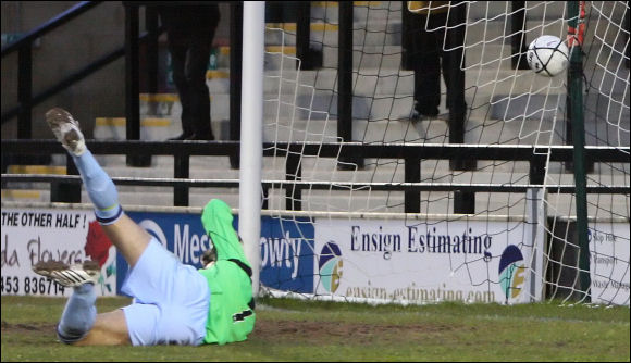 GOAL! Cheshunt keeper Nedvet Hussein is helpless to stop Alex Sykes' shot finding the net