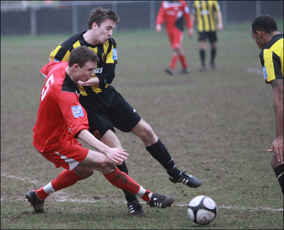 Mike Tambling is fouled by Redditch defender Joe Hull for the decisive penalty