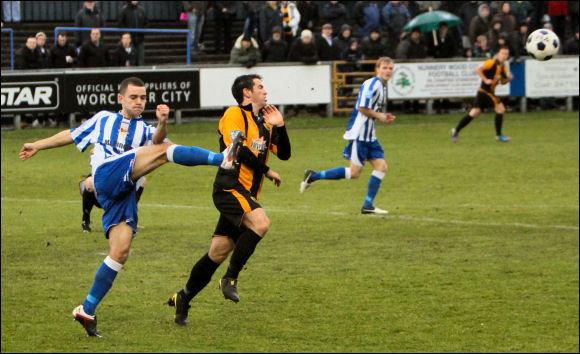 Ex-City man Tyler Weir clears under pressure from Adam Mann on Boxing Day