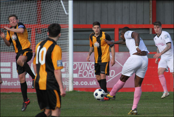 Tom Webb takes evasive action as Corby's Nat Wedderburn unleashes the winning goal