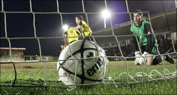 Ashley Morris looks devastated as the ball sits in the back of his net after Will Morford's equaliser